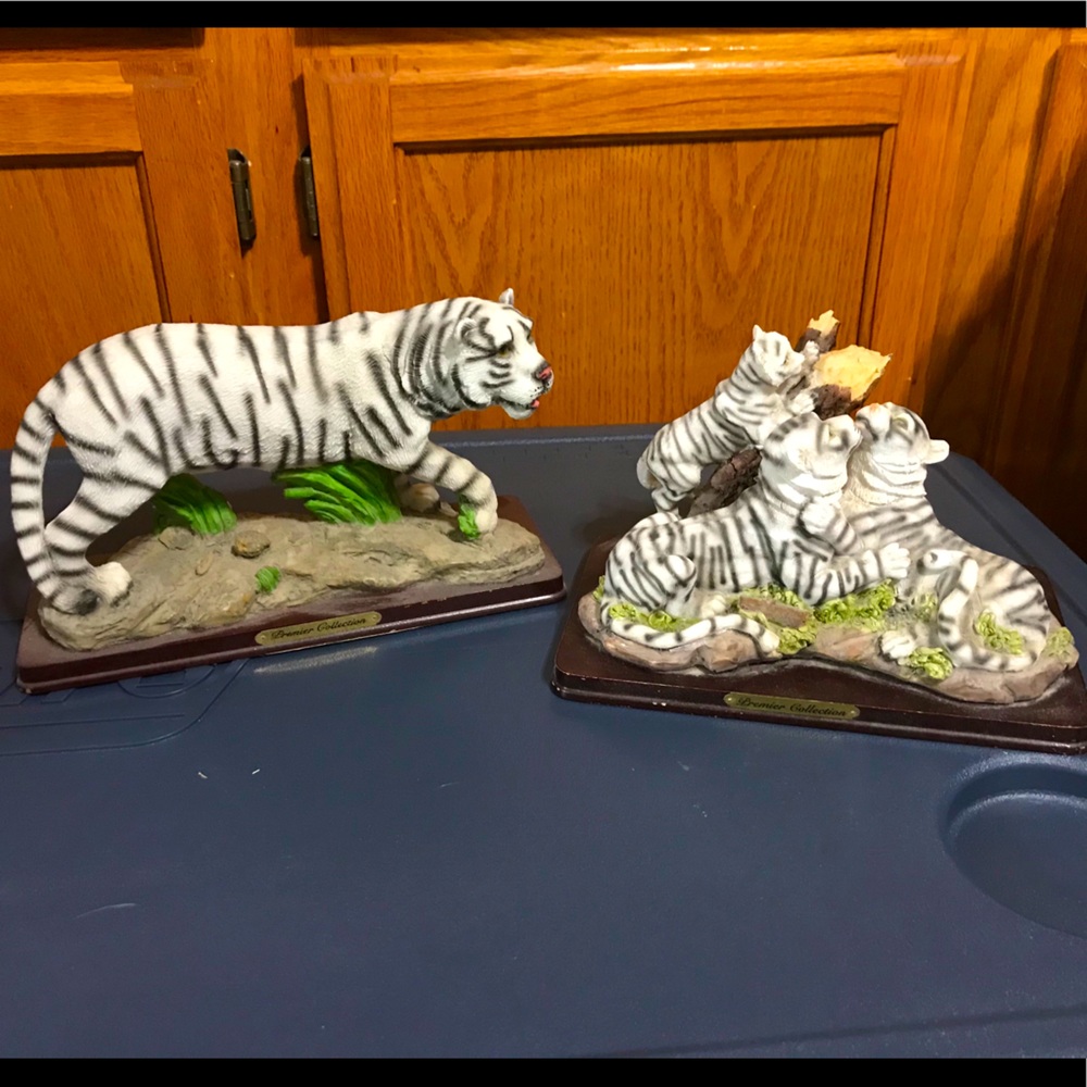 2 white tiger collectible figurines.